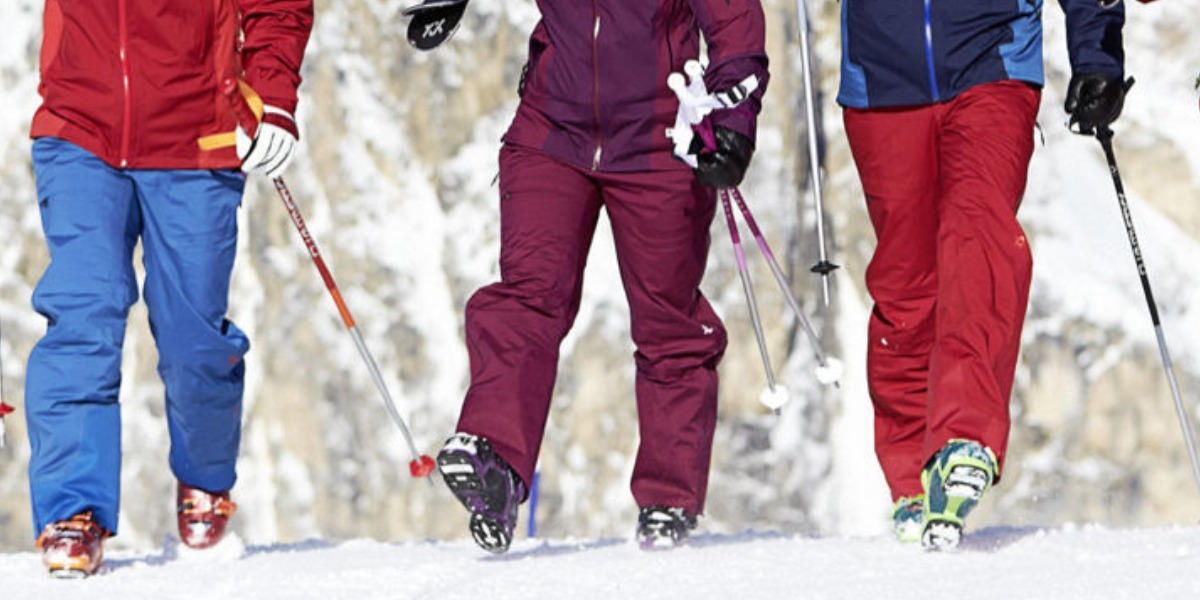 SKiers walking on the snow in Grip Walk boot soles