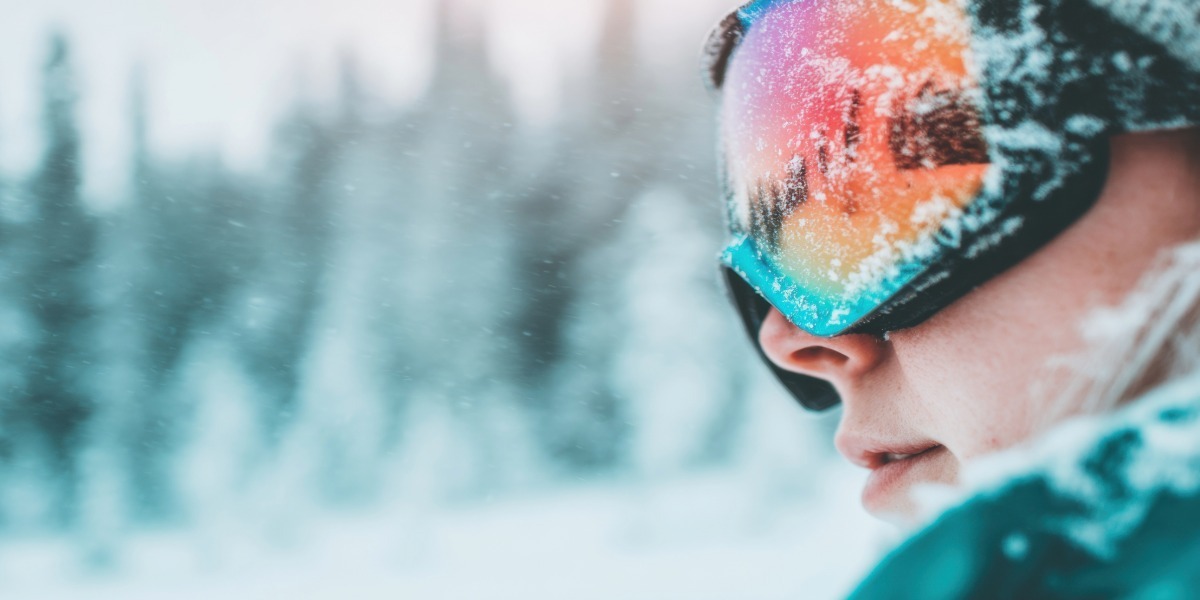 woman wearing goggles in a storm