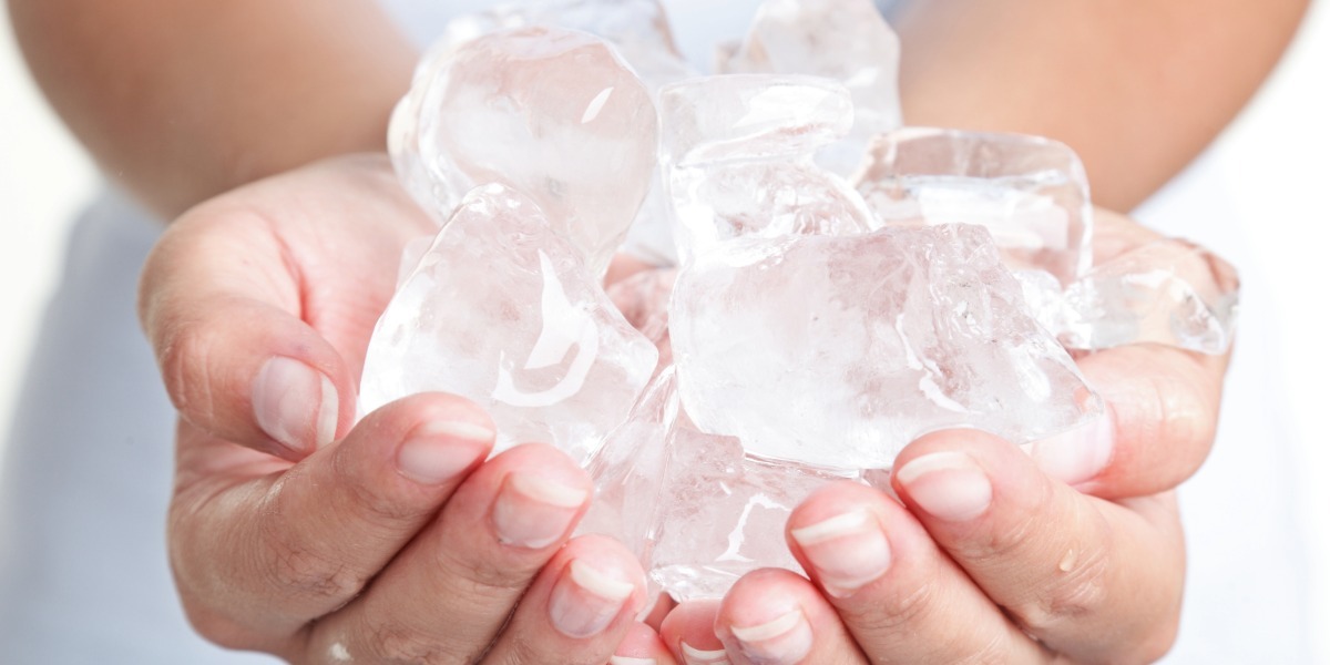 Woman's hands holding ice